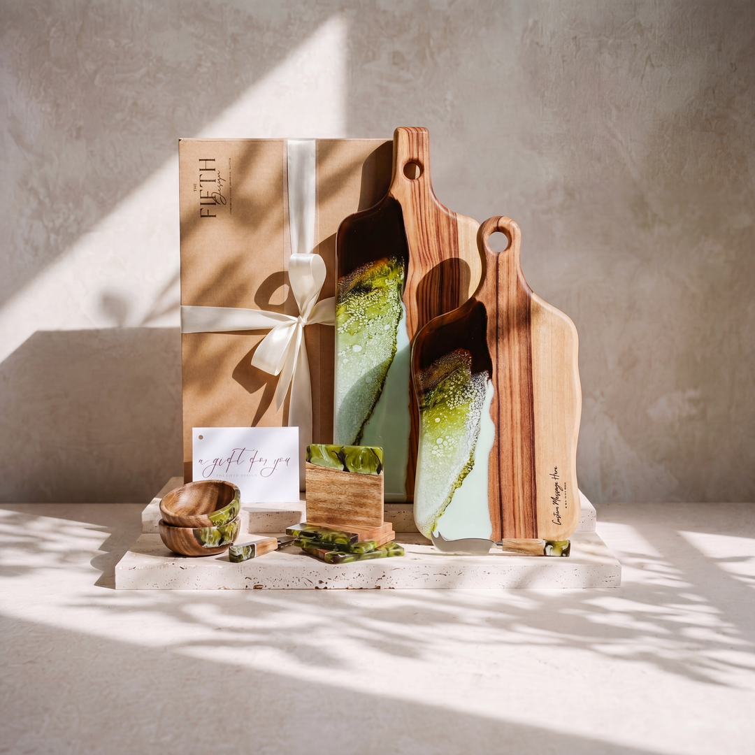 The Entertainer's Bundle in Sage Green - styled lifestyle hero, bundle arranged on travertine in warm editorial light