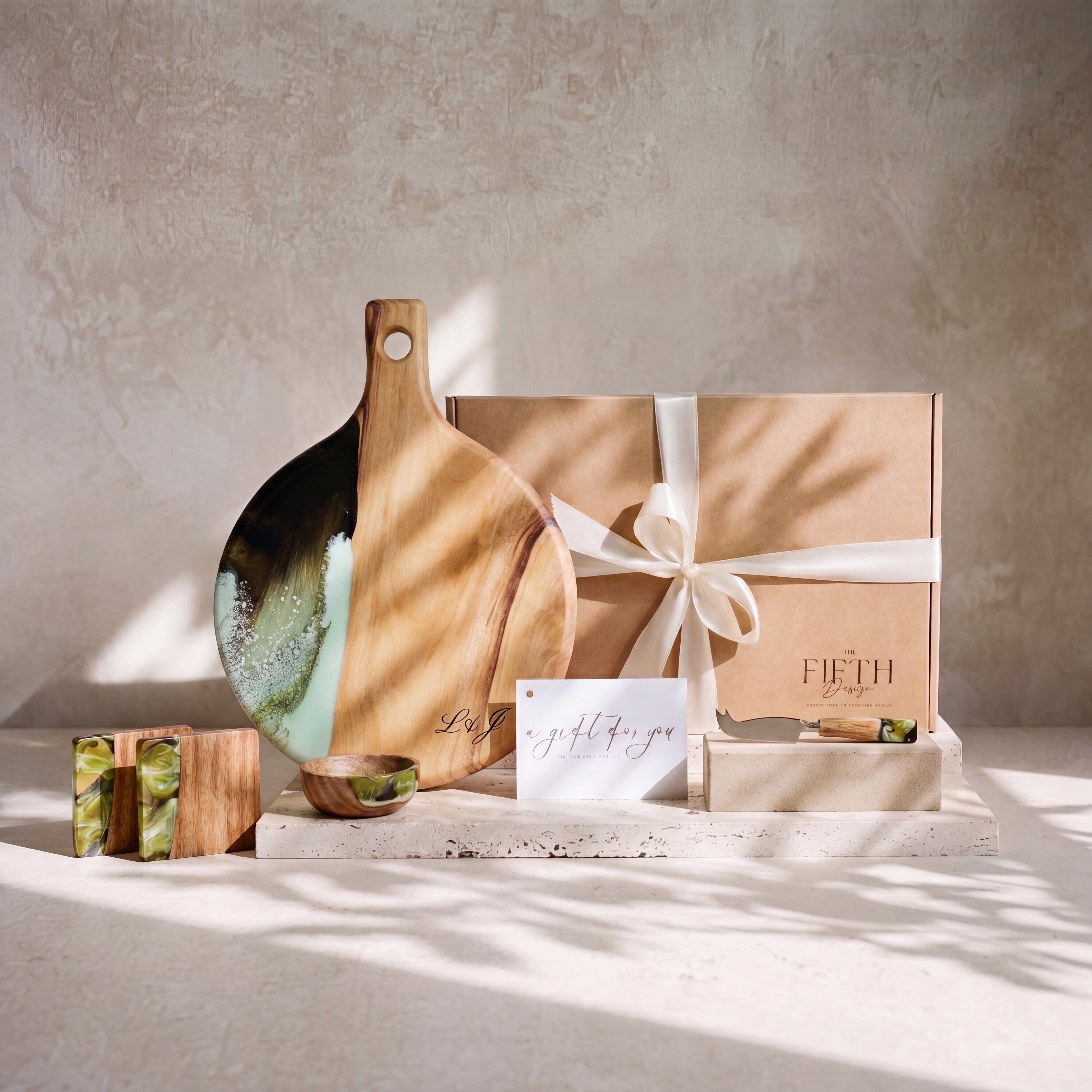 The Grazing Gift Box in Sage Green - styled lifestyle hero, bundle arranged on travertine in warm editorial light