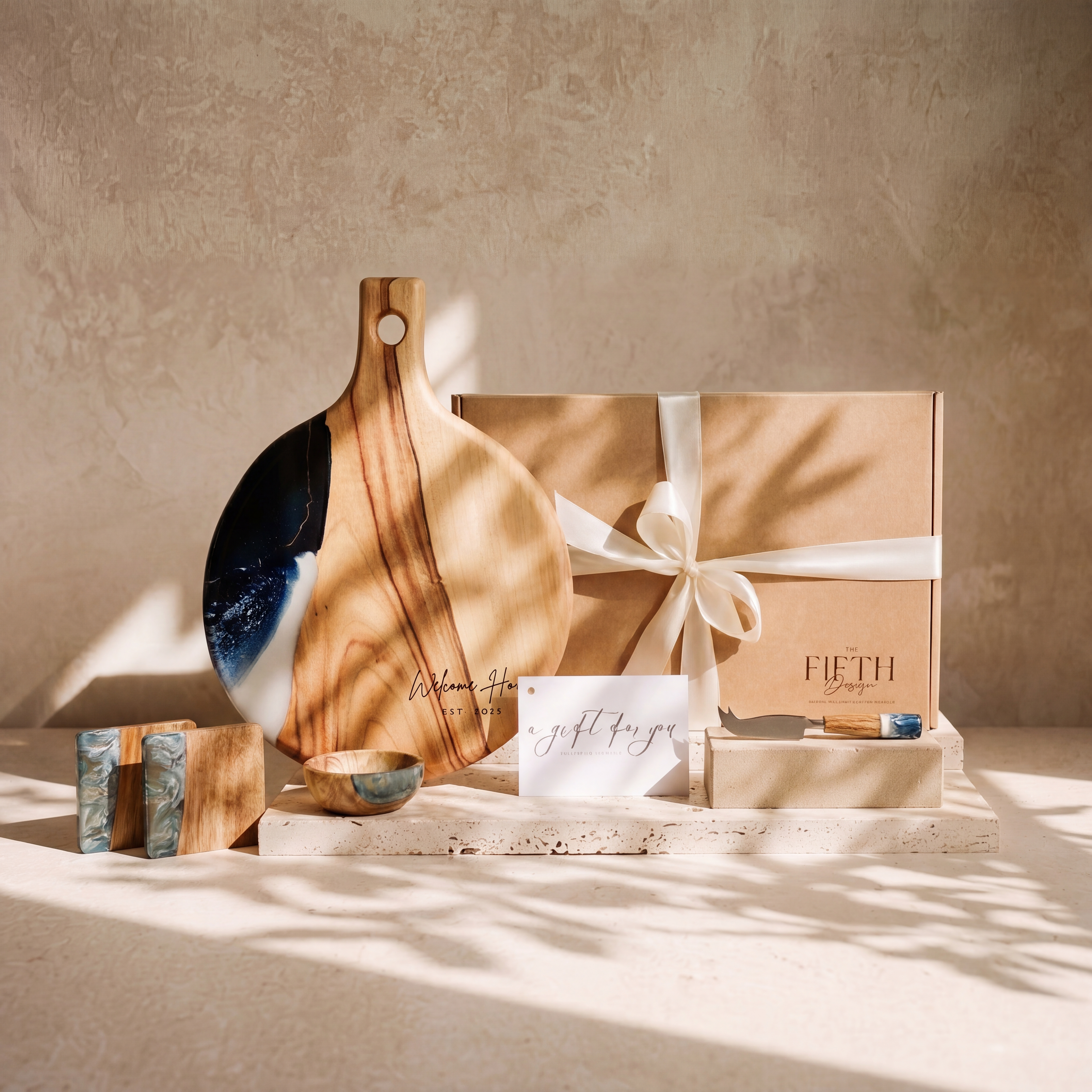 The Grazing Gift Box in Slate - styled lifestyle hero, bundle arranged on travertine in warm editorial light