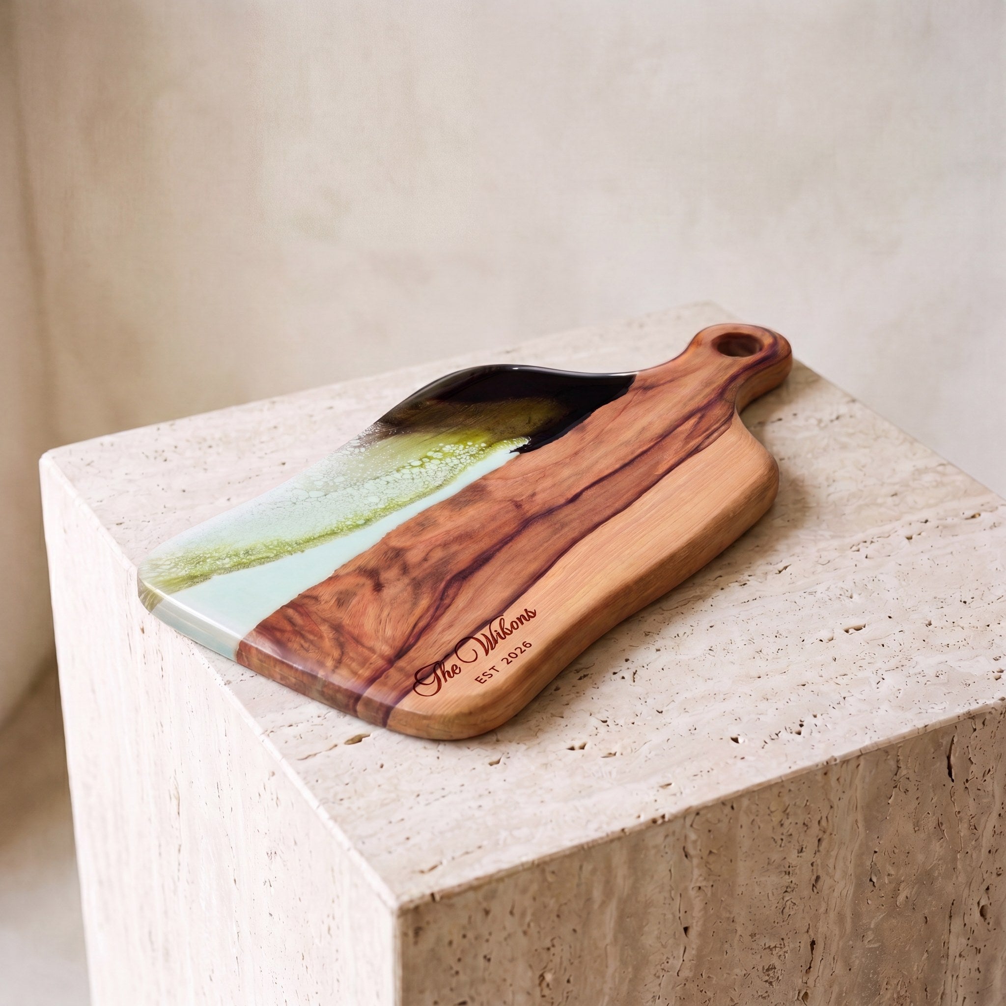 Medium Resin Paddle Board in Sage Green - Hero shot on travertine plinth #colour_sage-green