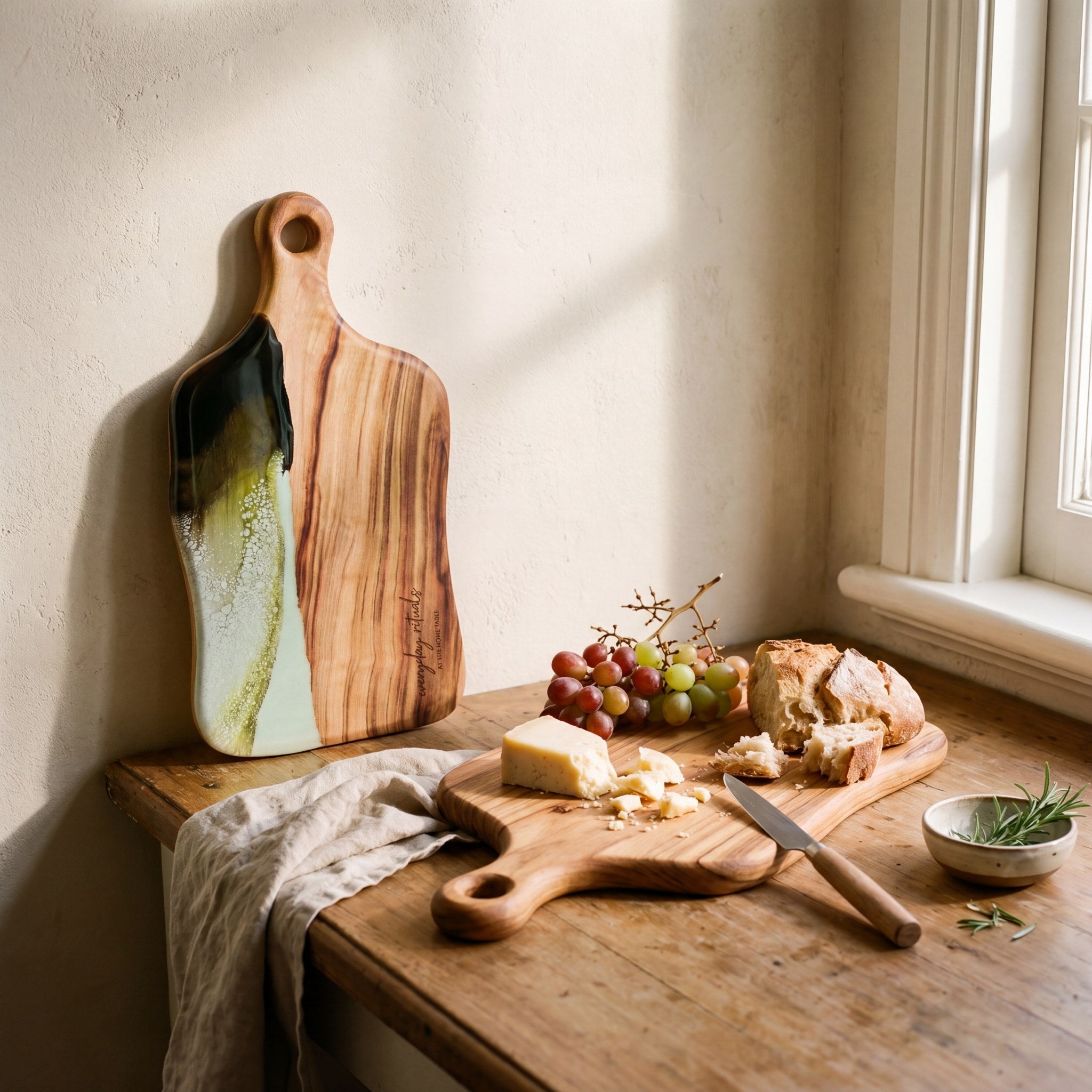 Medium Resin Paddle Board in Sage Green - Propped with a grazing spread #colour_sage-green