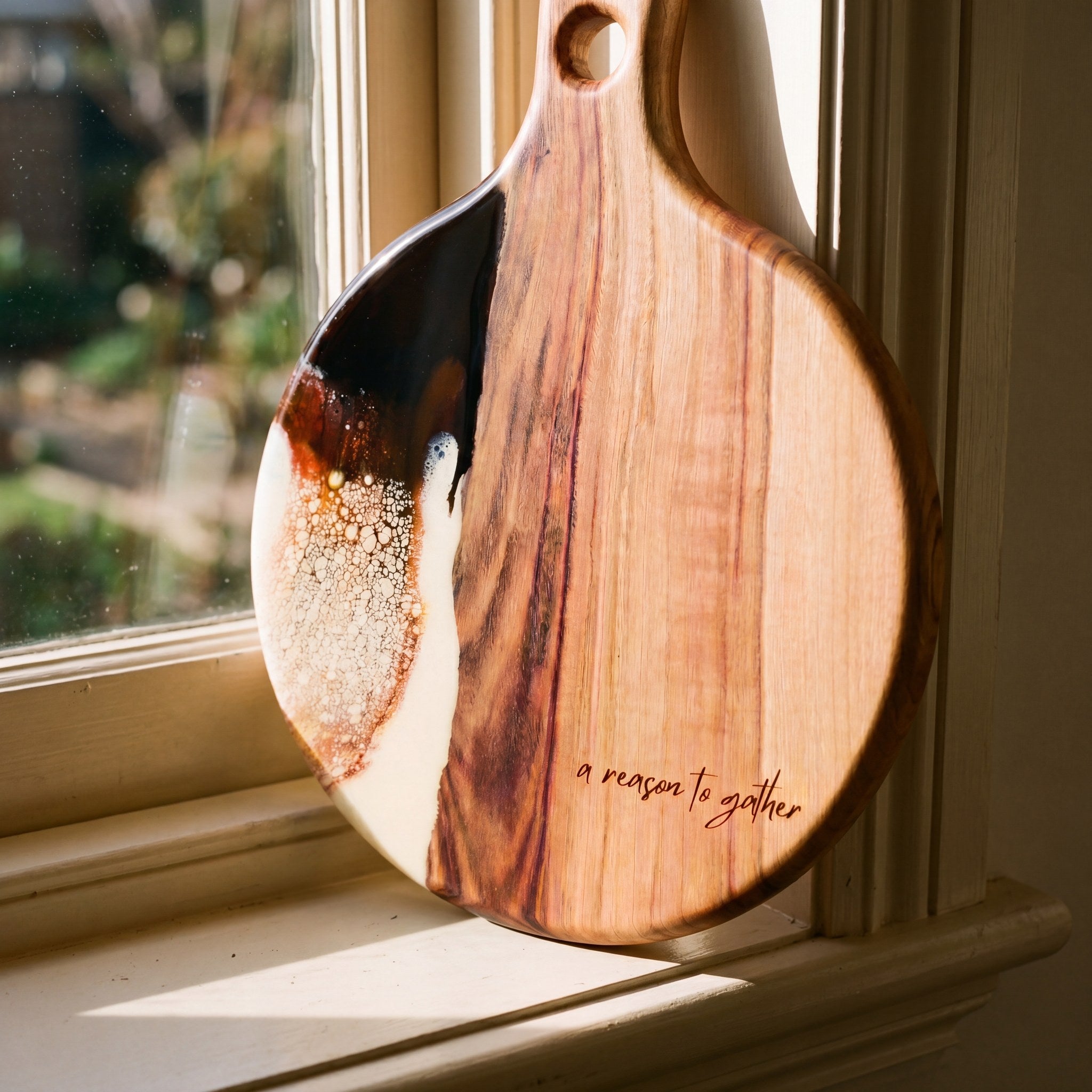 Round Resin Paddle in Burnt Ivory - Angled detail shot showing resin pattern and timber edge #colour_burnt-ivory