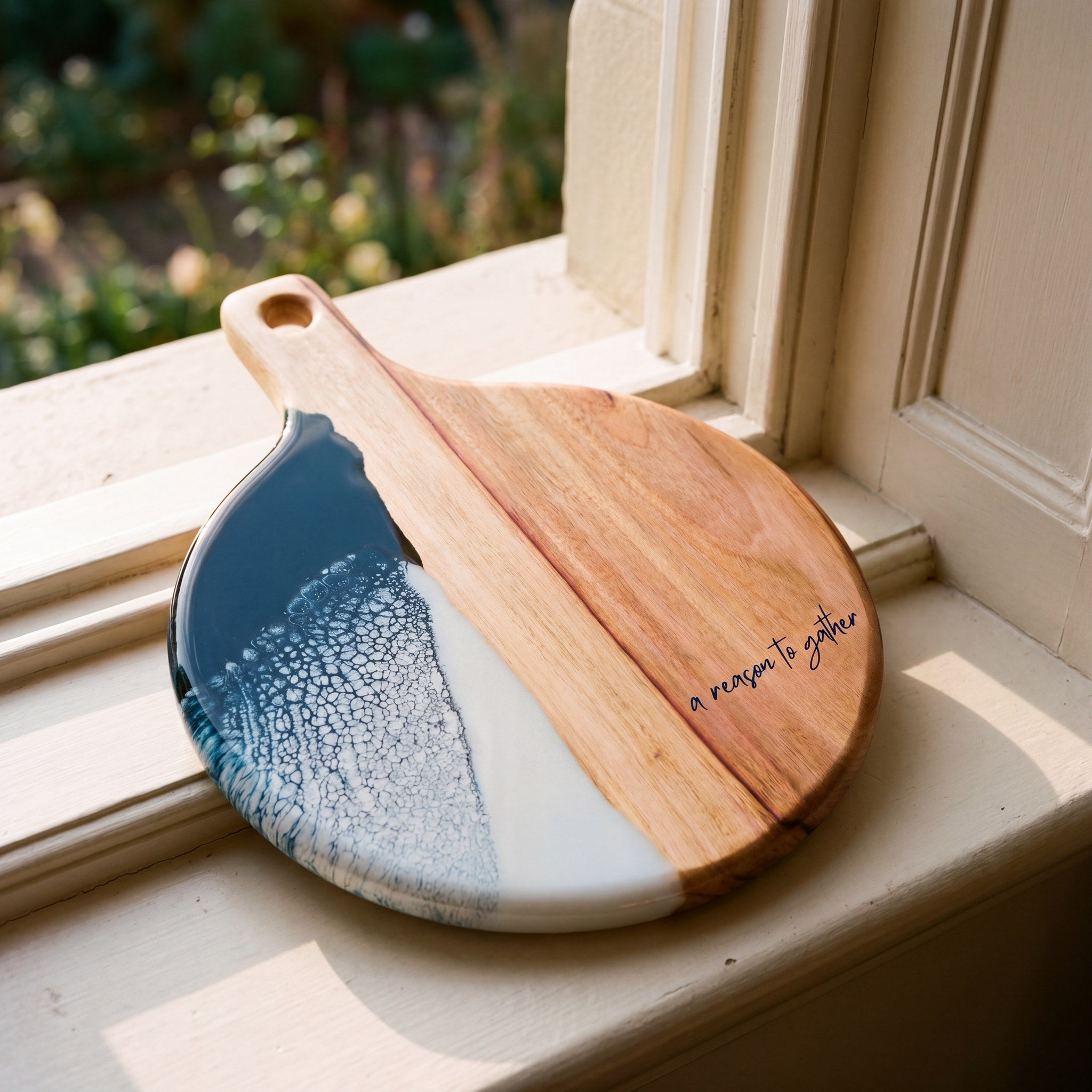 Round Resin Paddle in Prussian Blue - Angled detail shot showing resin pattern and timber edge #colour_prussian-blue