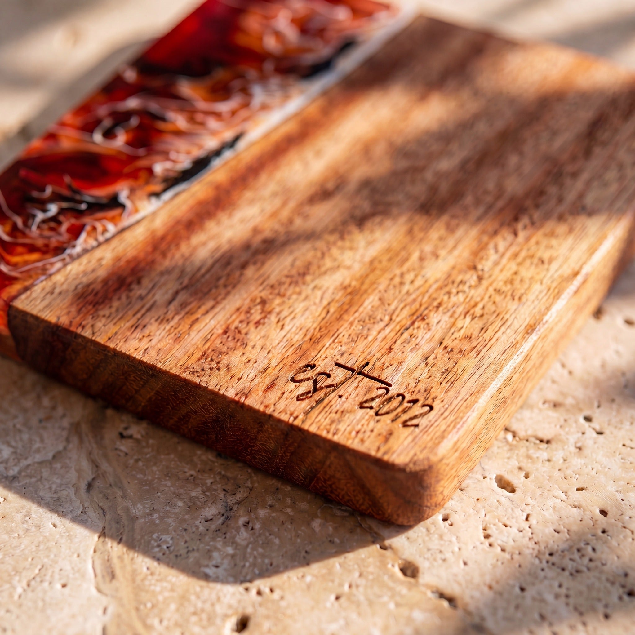 Burnt Ivory engraving detail on a resin and wood coaster