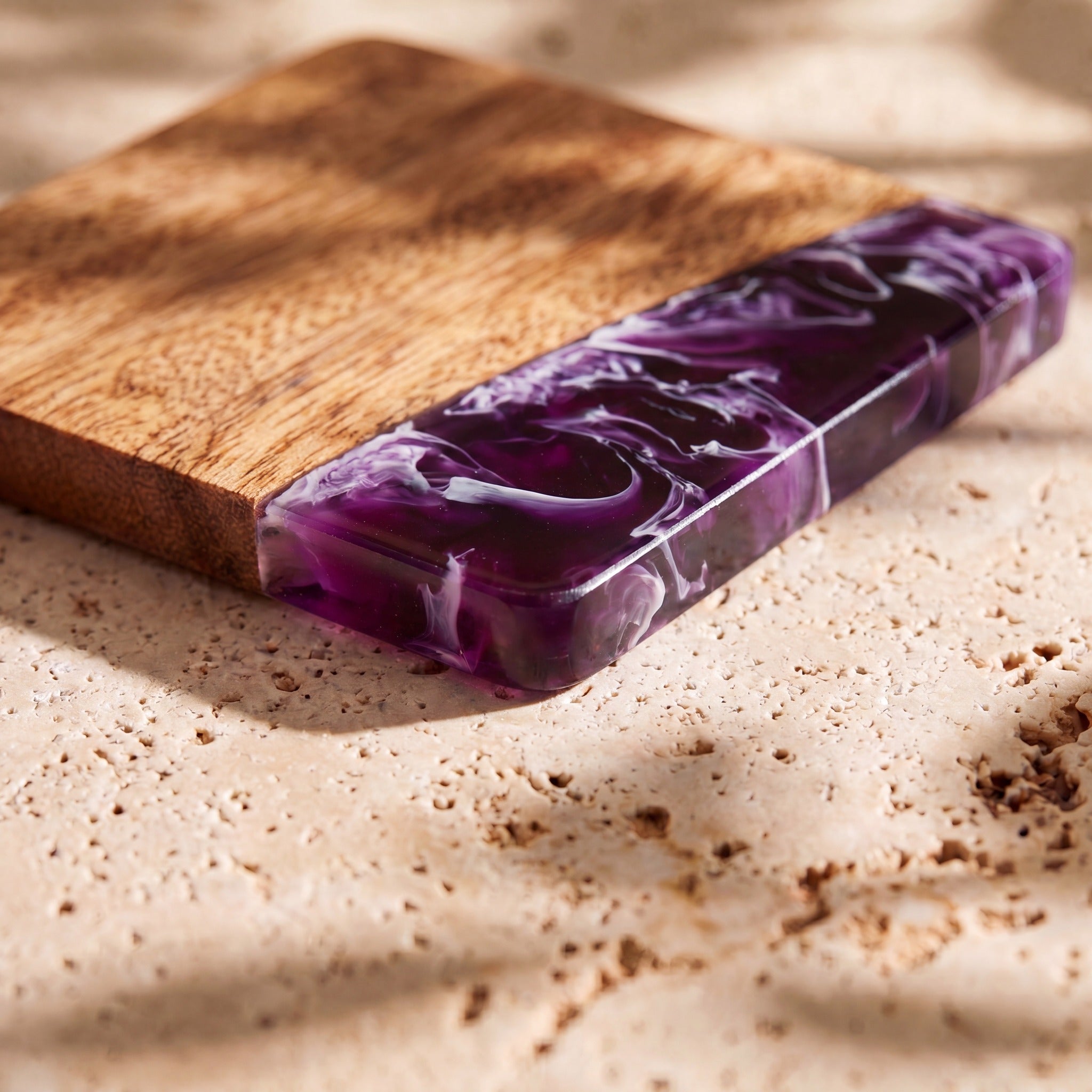 Lilac close up of the resin on a wood coaster
