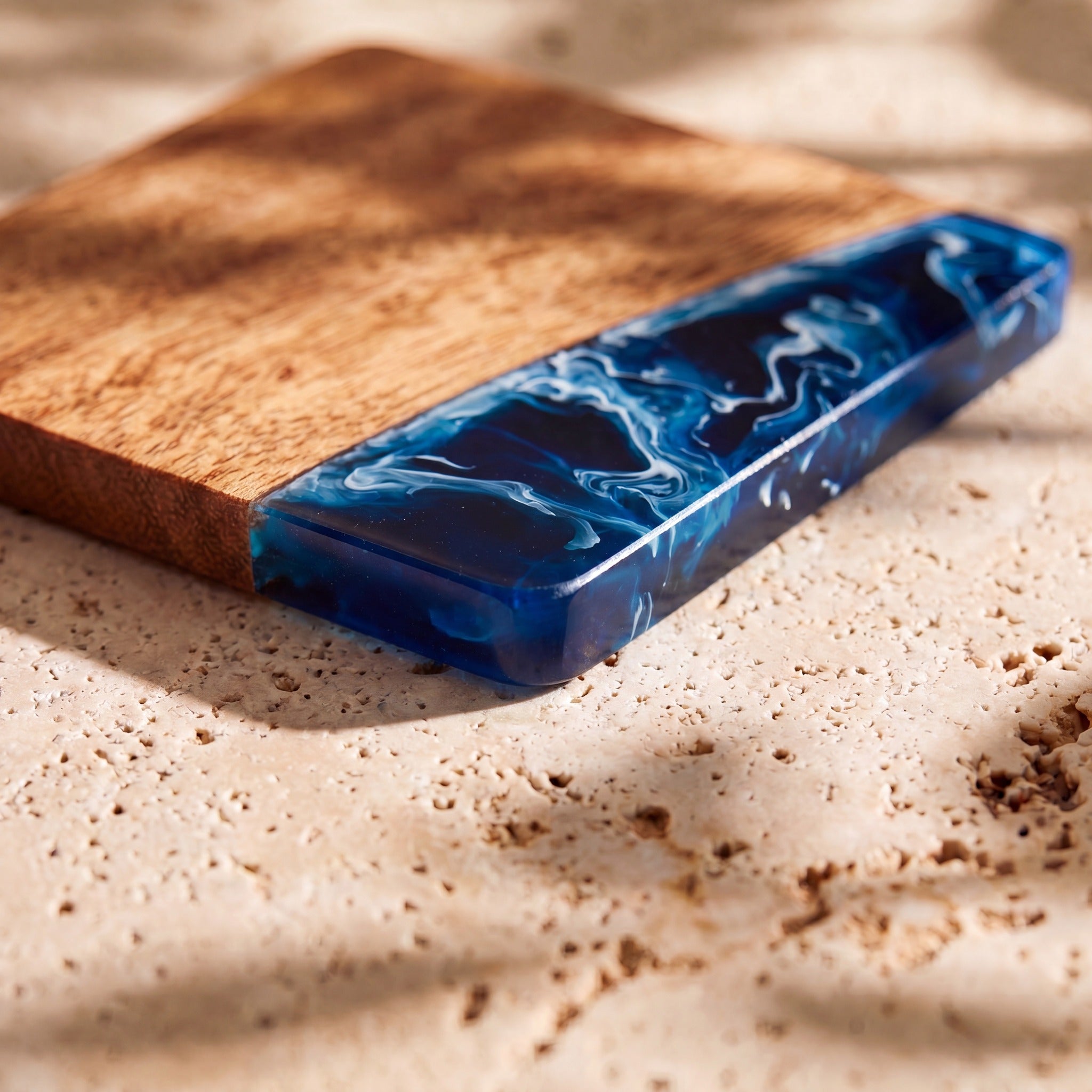 Prussian Blue close up of the resin on a wood coaster