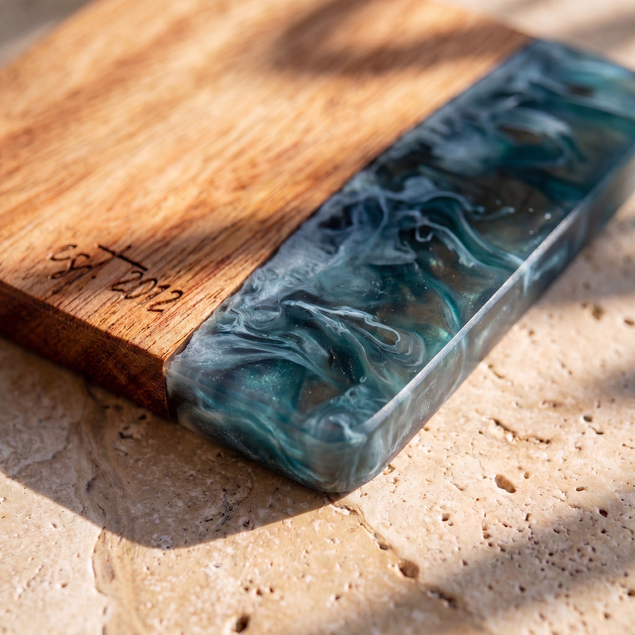 Slate engraving detail on a resin and wood coaster