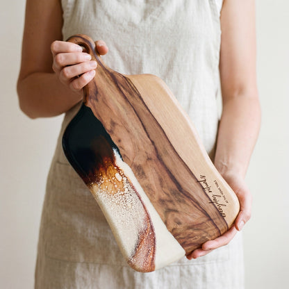 The Entertainer's Bundle in Burnt Ivory - Medium paddle held in hand for scale