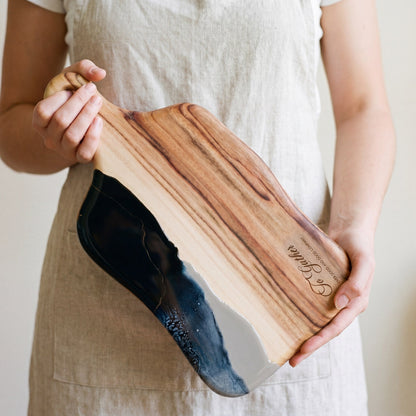 The Entertainer's Bundle in Slate - Medium paddle held in hand for scale