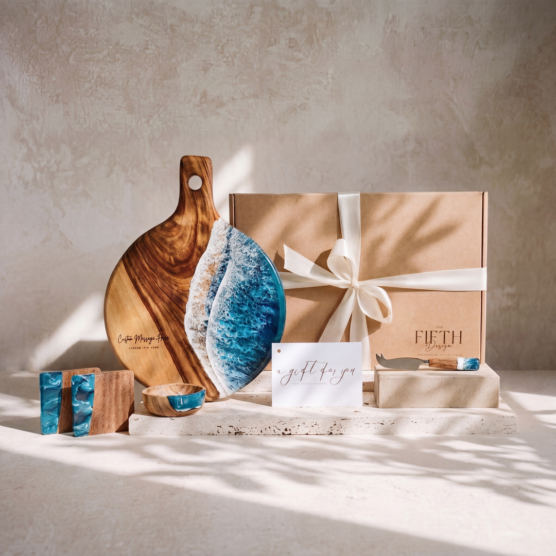 The Grazing Gift Box in Seascape - styled lifestyle hero, bundle arranged on travertine in warm editorial light