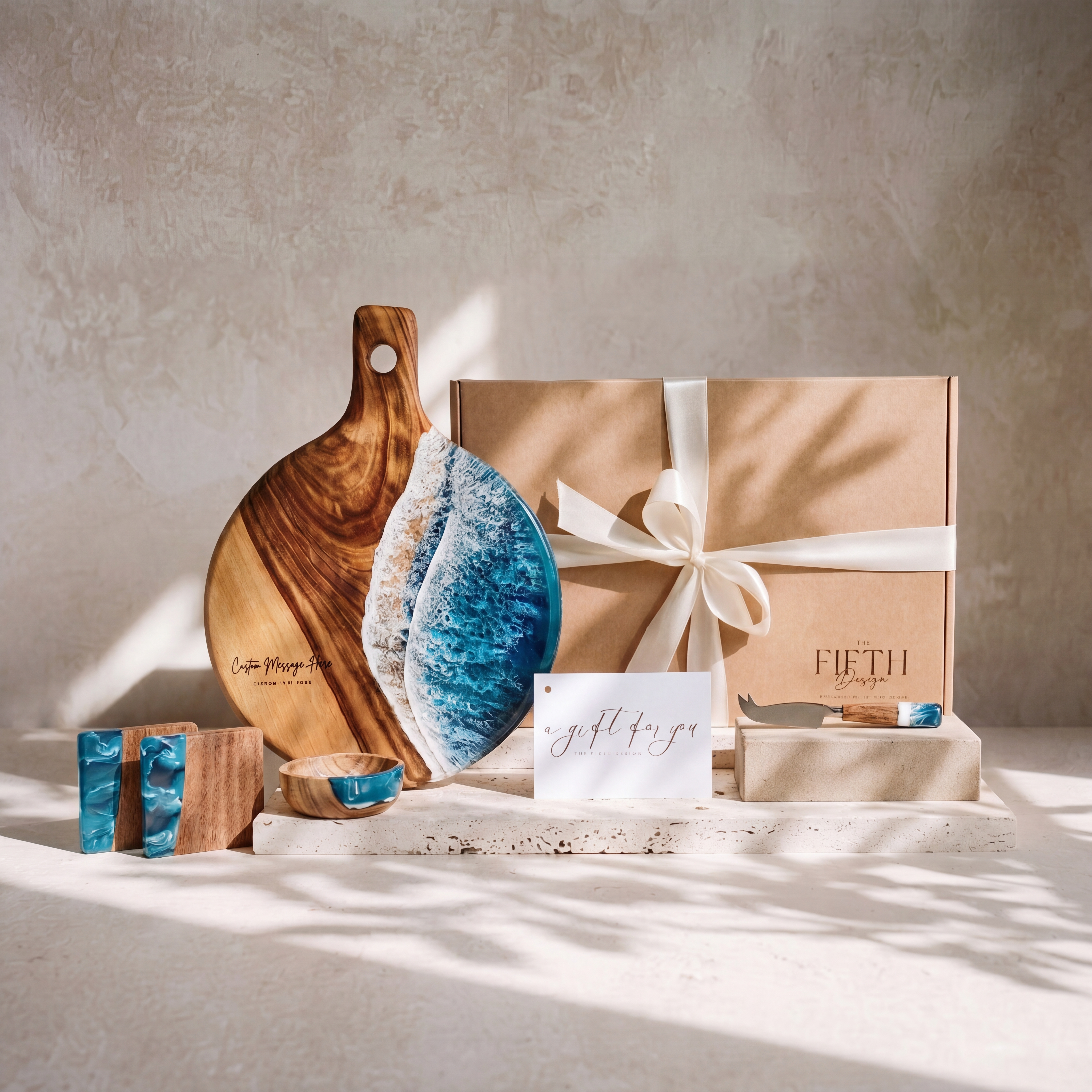 The Grazing Gift Box in Seascape - styled lifestyle hero, bundle arranged on travertine in warm editorial light