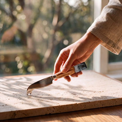 Resin Cheese Knife in Slate - held to show scale #colour_slate