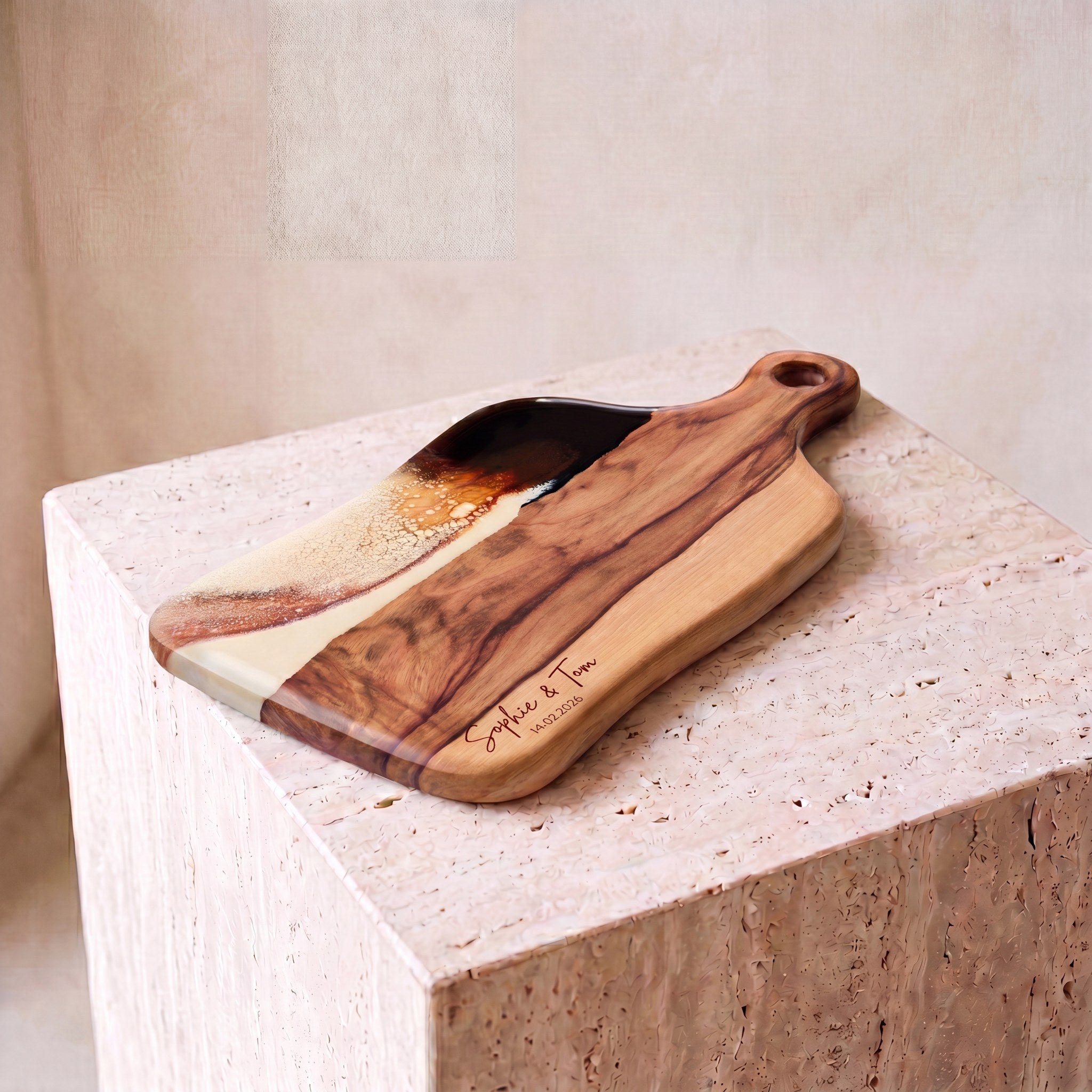 Medium Resin Paddle Board in Burnt Ivory - Hero shot on travertine plinth #colour_burnt-ivory