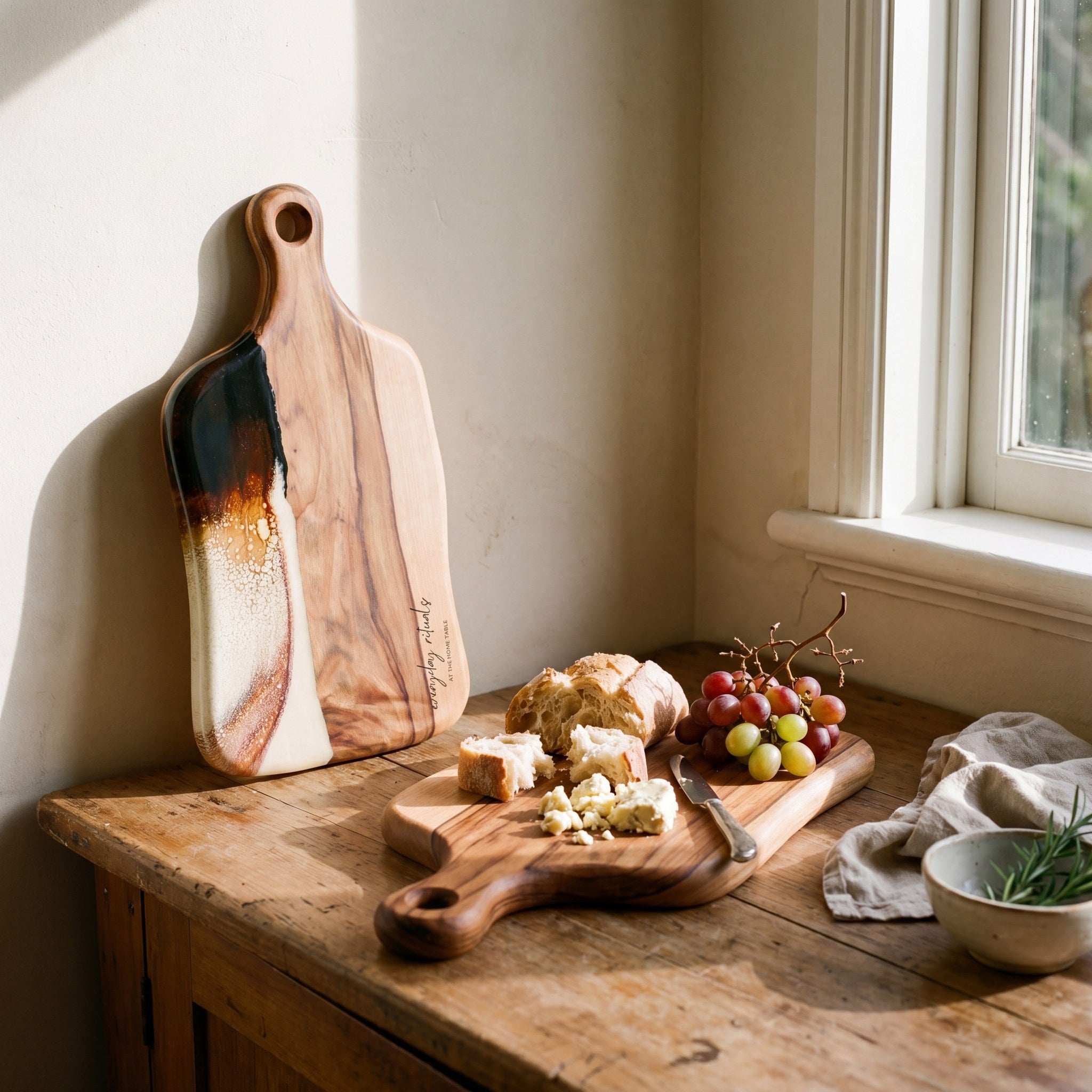 Medium Resin Paddle Board in Burnt Ivory - Propped with a grazing spread #colour_burnt-ivory