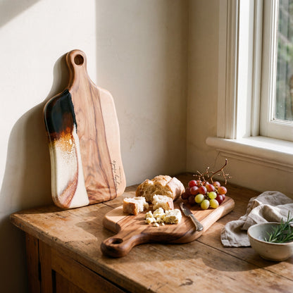 Medium Resin Paddle Board in Burnt Ivory - Propped with a grazing spread #colour_burnt-ivory