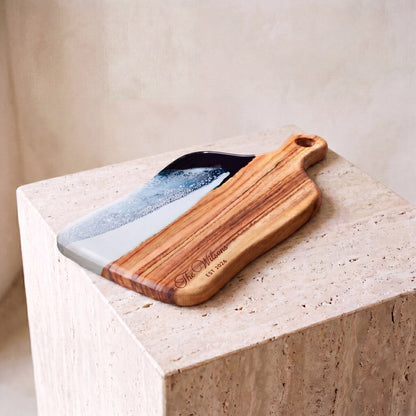 Medium Resin Paddle Board in Prussian Blue - Hero shot on travertine plinth #colour_prussian-blue