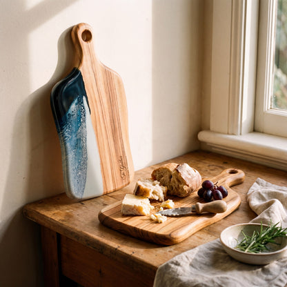 Medium Resin Paddle Board in Prussian Blue - Propped with a grazing spread #colour_prussian-blue