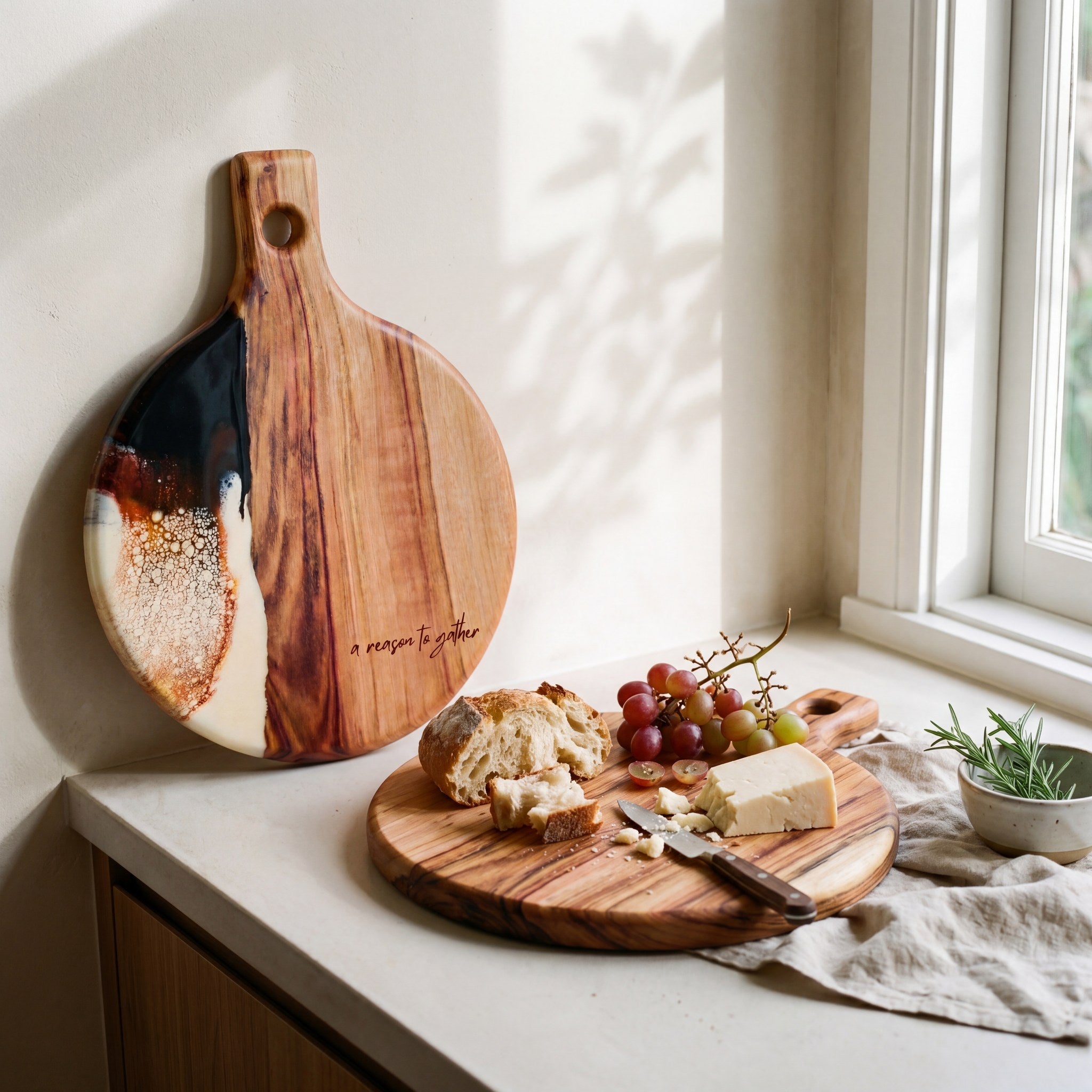 Round Resin Paddle in Burnt Ivory - Lifestyle scene with cheese and accompaniments styled on board #colour_burnt-ivory