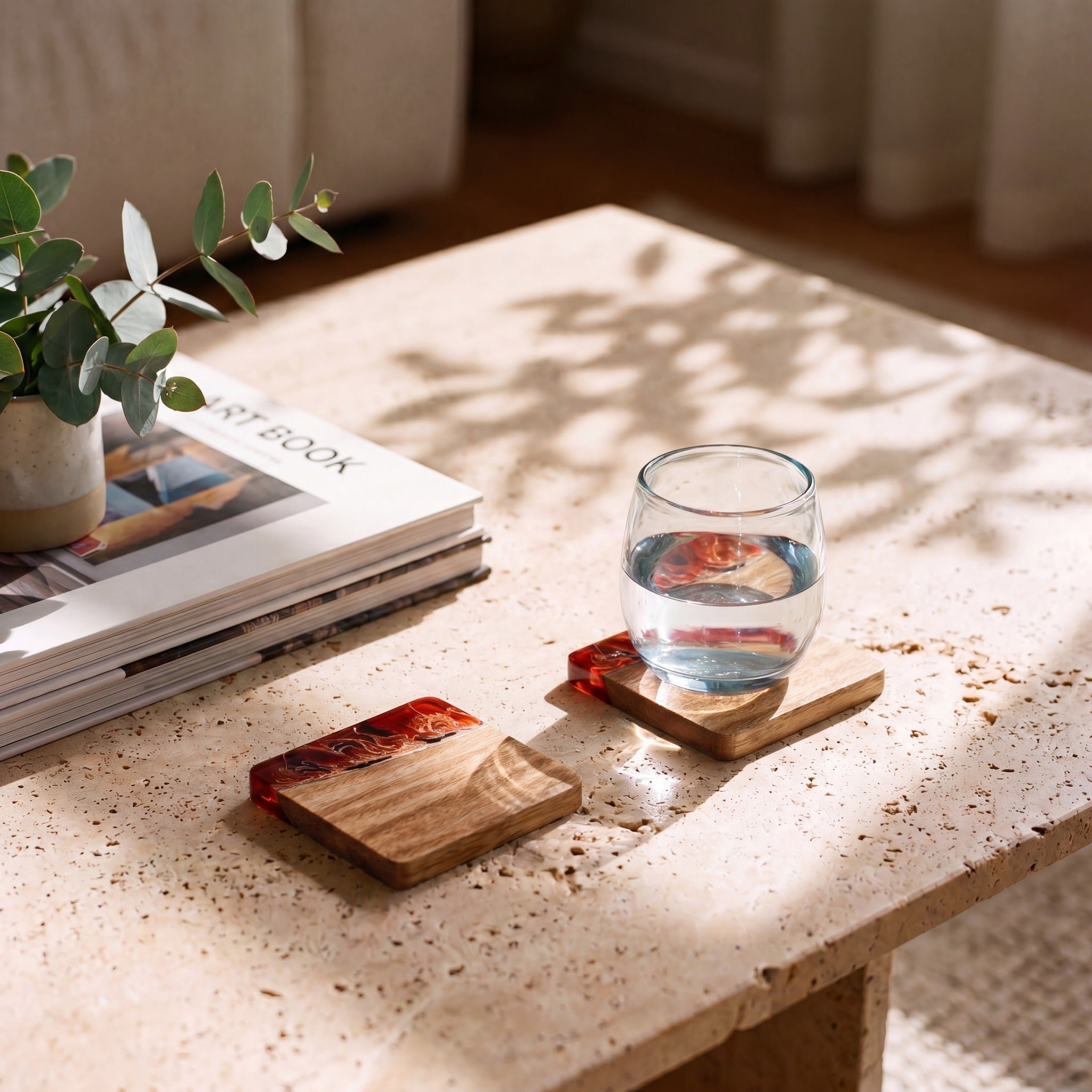 Burnt Ivory resin and wood coasters on a coffee table
