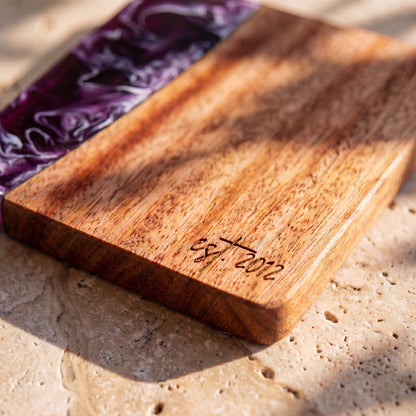 Lilac engraving detail on a resin and wood coaster