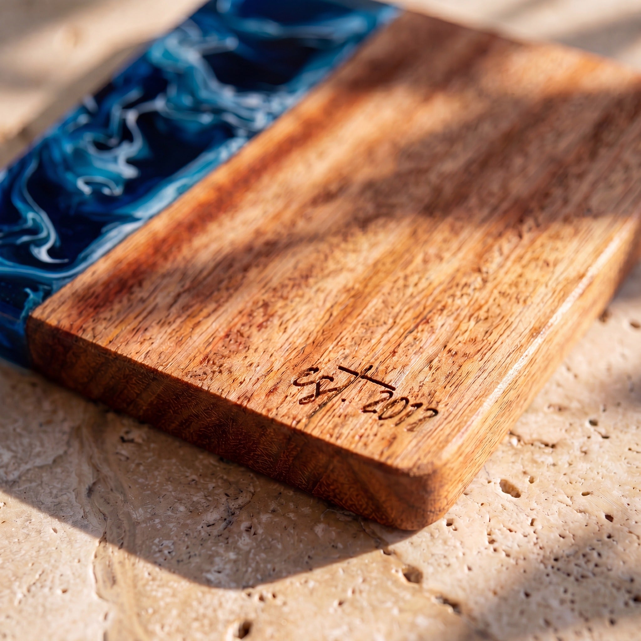 Prussian Blue engraving detail on a resin and wood coaster