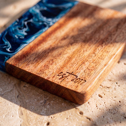 Prussian Blue engraving detail on a resin and wood coaster