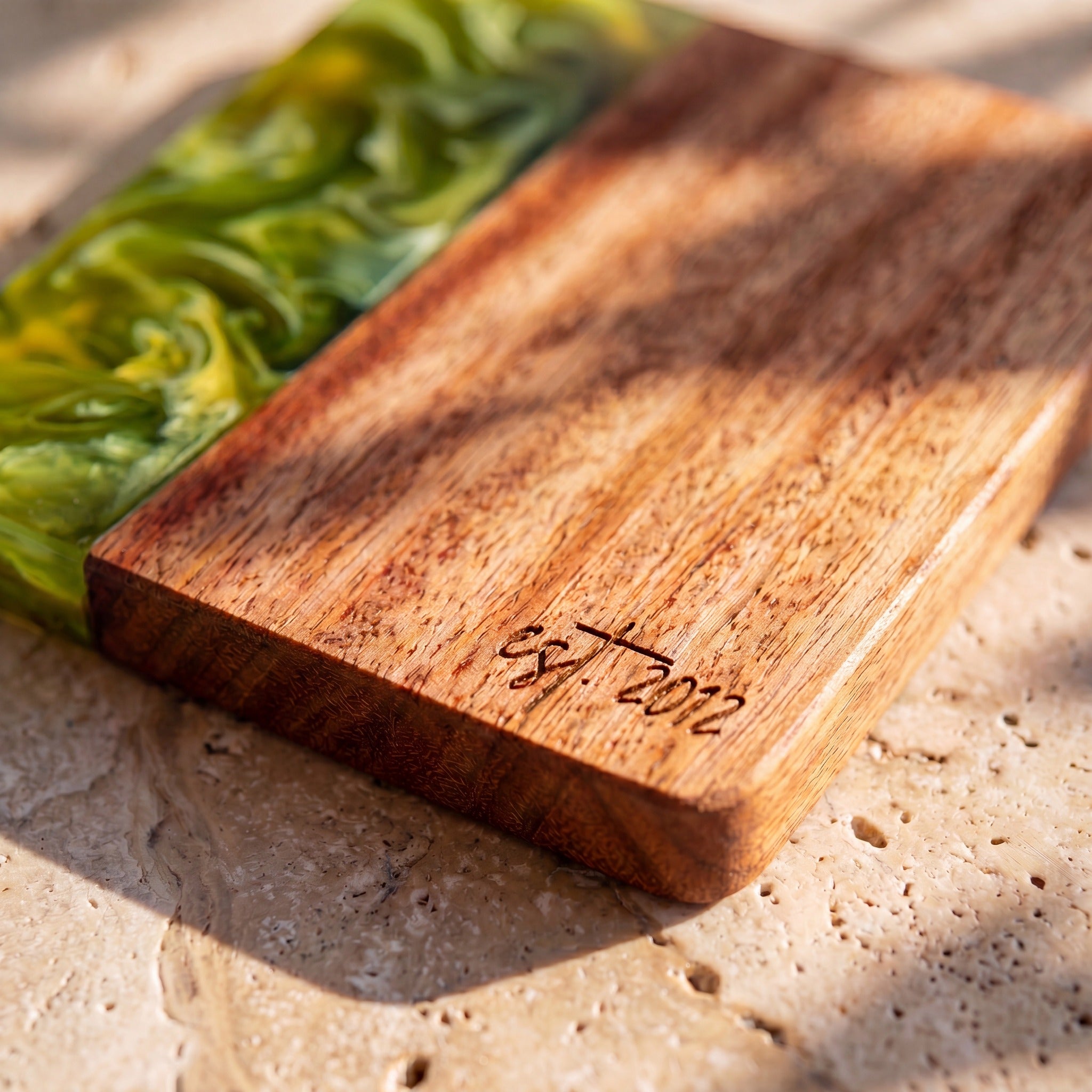 Sage Green engraving detail on a resin and wood coaster